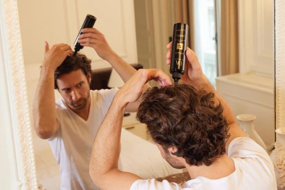 Intact 5 Pre-Shampoo 5 man apply intact 5 pre-shampoo to his scalp